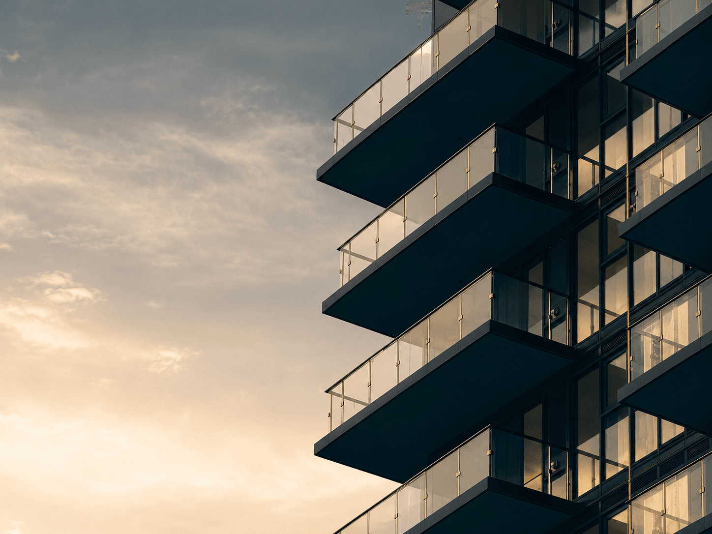 Modern residential building at sunset