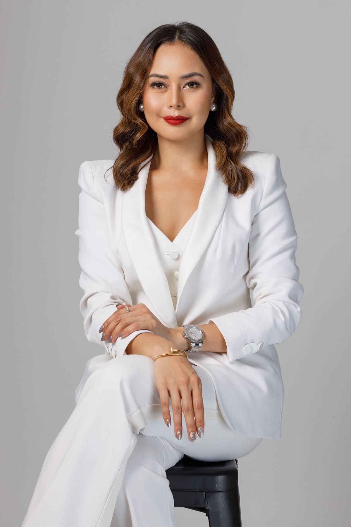 JM Lumabi in a white professional suit